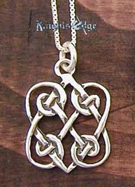Sterling Silver Celtic Love Knot. Two Hearts entwined in silver celtic knots. 5/8