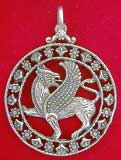 Griffin jewelry - Great Griffin a mighty creature from Greek Mythology which has the body of a lion and the wings and head of an eagle, takes a striking pose inside circular filigree framework. Sterling Silver. 1-5/16