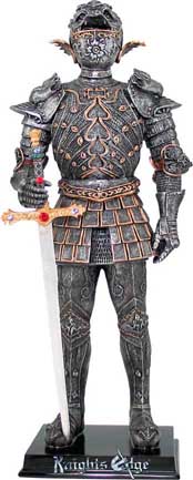 A glorious knight figure with jeweled sword exemplifies the artistry of medieval armourers. This medieval knight is expertly cast in resin. The figurine has antique pewter finish and is hand detailed with striking gold accents.